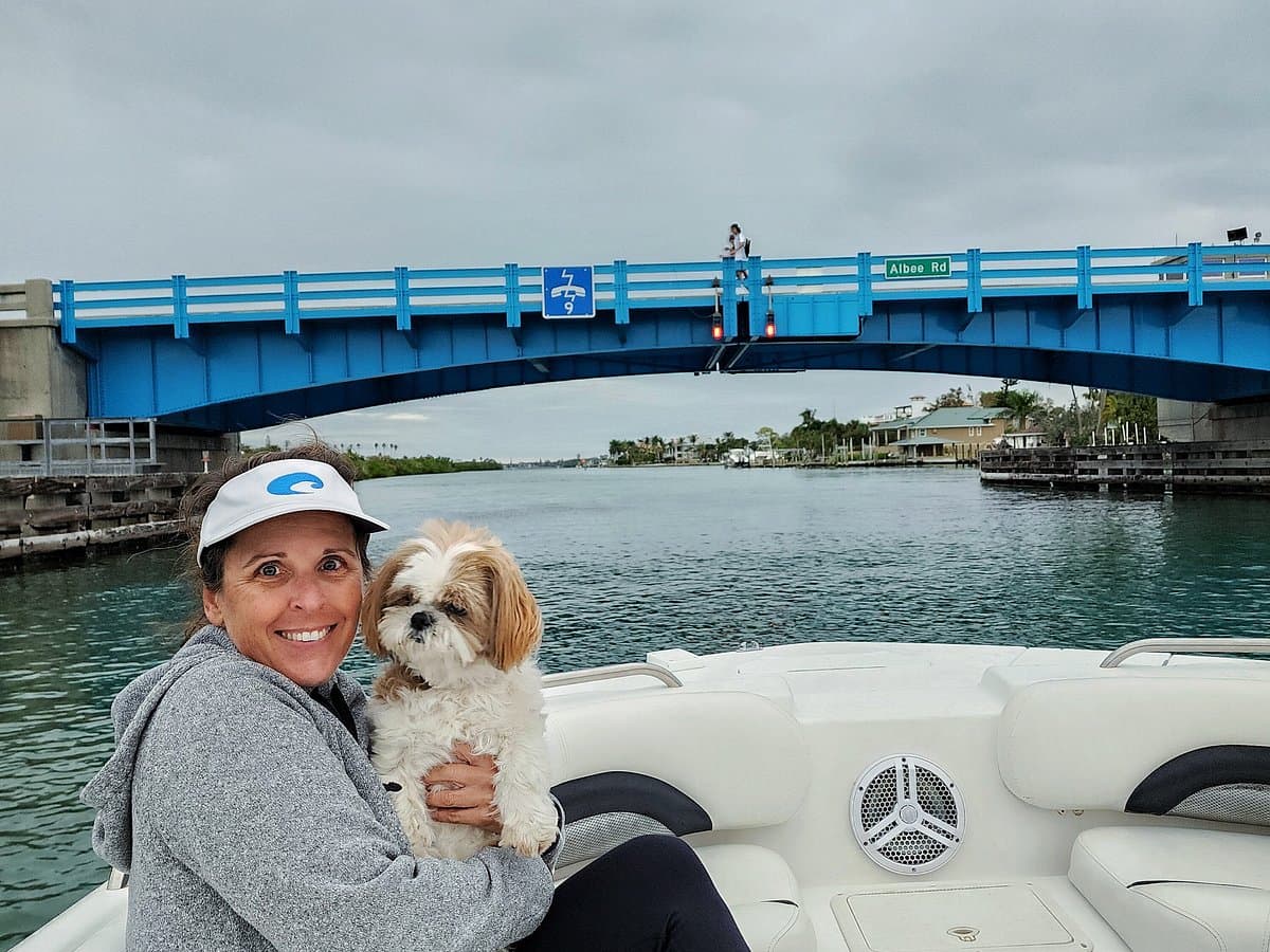Captain Jenn aboard Great Day Boat Tours, under the Albee Road bridge, Venice FL